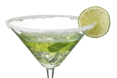 Close-up shot of martini glass with peppermint and lemon juice while lemon slice decorated on top.の写真素材