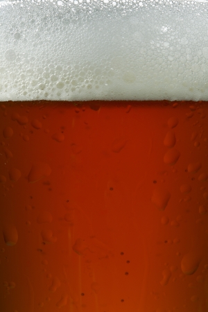 Close-up image of a mug of beer with foamの写真素材
