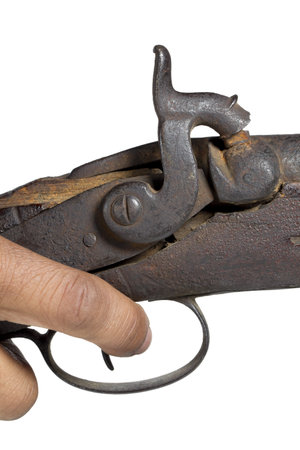 Old rifle with a human hand
