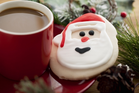 santa claus biscuit and hot chocolate in a red plateの写真素材