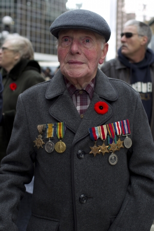 View of a senior citizen wearing cap and military uniform on Remembrance Day.のeditorial素材
