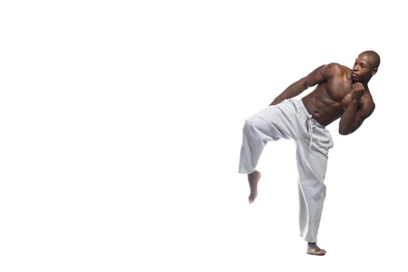 African American man practicing karate over white background, Model: Gregory Dawsonの写真素材