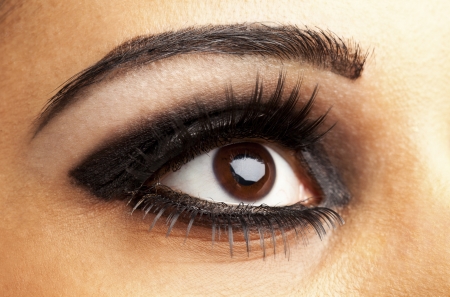 Detailed shot of attractive female's eyes with false eye lashes. Model: Kiran Bahugunの写真素材