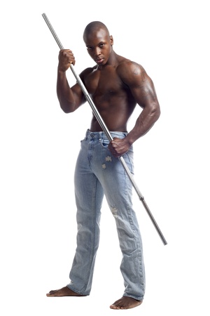 Portrait of a muscular African American man posing with a rod against white background, Model: Gregory Dawsonの写真素材