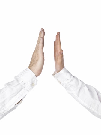 Close up image of business man doing a high five against white backgroundの写真素材