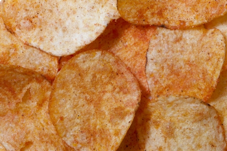 A pile of crispy cheese flavored potato chipsの写真素材
