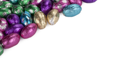 Cropped image of a group of chocolate eggs isolated in a white background