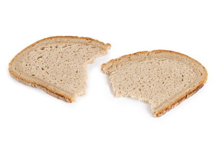 One sliced and broken loaf of breadの写真素材