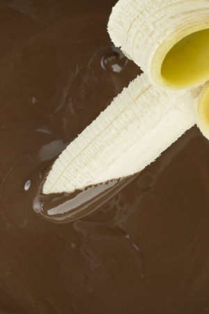Chocolate sauce and banana fruit in a cropped imageの写真素材