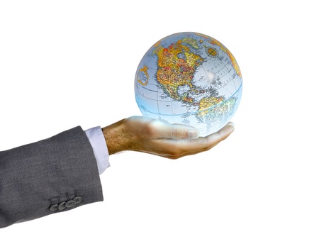 Cropped image of a businessman's hand holding a globe, Model: Adam Miraniの写真素材