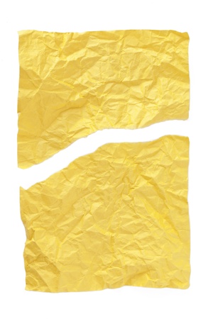 Crumpled and cracked yellow paper on a white backgroundの写真素材
