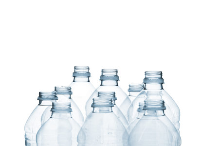 Detailed shot of plastic bottle on plain white background.