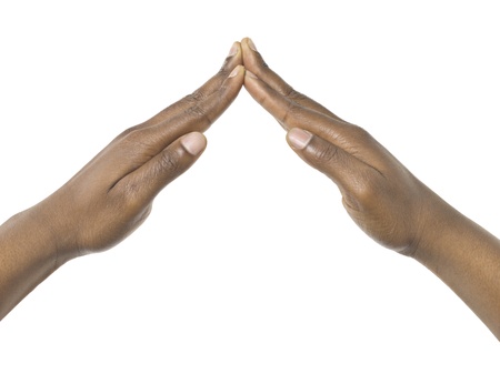 Human hands gesturing like a houseの写真素材