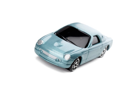 Isolated image of light-blue car with rounded headlights over a white background
