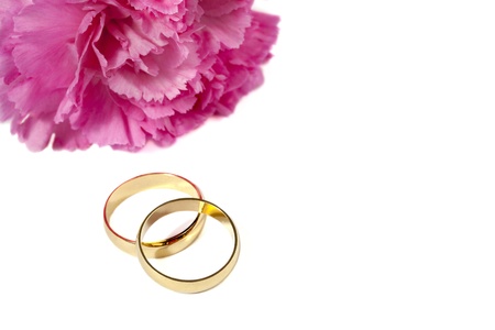 Close up image of two rings with pink flower isolated on white backgroundの写真素材