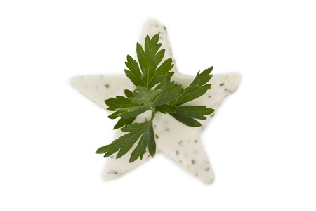 Close up image of star shape herb butter with parsley against white backgroundの写真素材