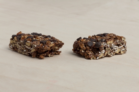Close up image of delicious granola bars wooden tableの写真素材