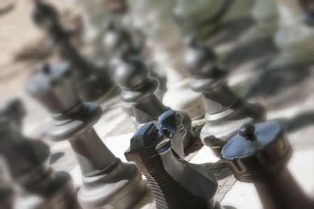Closed up black chess pieces on a chessboardの写真素材