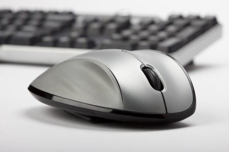 Mouse in foreground and keyboard blurred keyboard in background.の写真素材