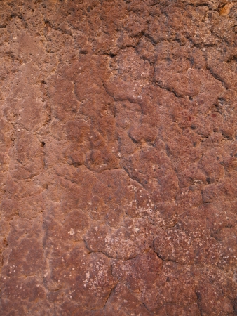 A lumpy wall painted orangeの写真素材