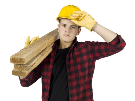 Close-up image of a carpenter with plank on the shoulderの写真素材