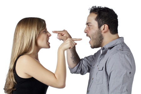 Horizontal image of a couple pointing a finger on each otherの写真素材