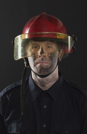Closeup shot of a firefighter with dirty faceの写真素材