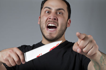 Image of mad angry guy holding a knife