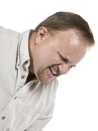 Cropped image of an old man suffering great pain isolated in a white backgroundの写真素材
