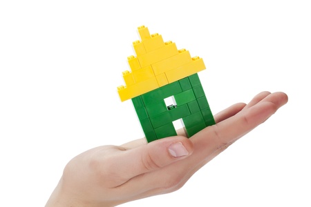 Image of human hand with mini houseの写真素材
