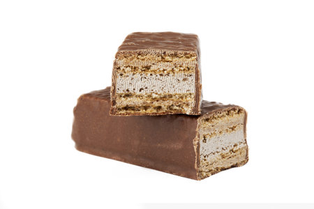 Close up image of two slices of chocolate bars white background