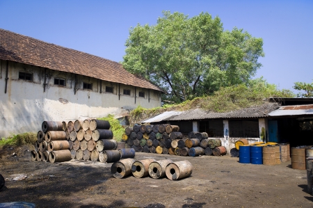 Empty oil drums sitting in a courtyard in Kochi, India.の写真素材