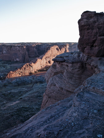 Image of sandstone cliff with clear sky in background.の写真素材