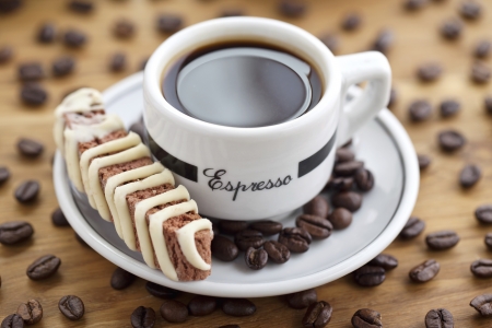 Close-up shot of coffee beans and drink with cookiesの写真素材