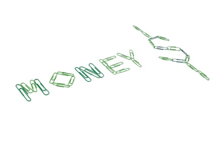 Green paper clip forming dollar sign and money word on a white backgroundの写真素材