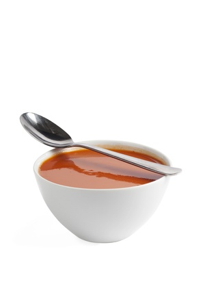 Close up image of bowl of tomato soup with spoonの写真素材