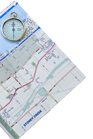 Cropped image of map and compass against white background