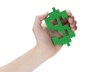 Human hand holding a Lego that assembled into dollar signの写真素材
