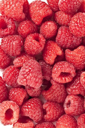 Close-up image of sweet raspberries on a white backgroundの写真素材