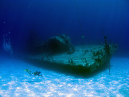 Videographer filming the sunken Shipwreck Tibbits in Cayman Brac