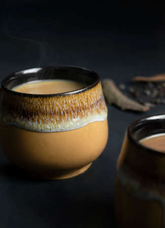 A close image of tea with dark background and foregroundの写真素材