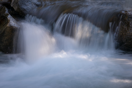 Flowing water of the rocks in mountain river / stream in Bishop, Californiaの写真素材