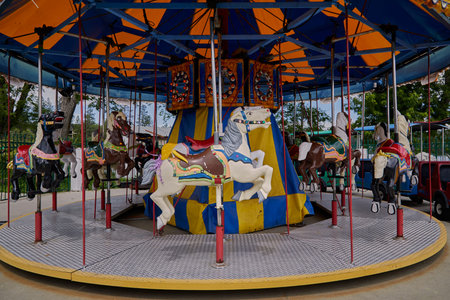 Carousel horses on a Merry Go Round at an amusement park