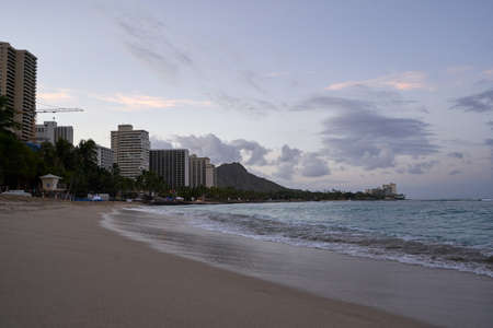 Empty Waikiki Beach on the island of Oahu, Hawaii at Sunrise.Diamond head in the backgroundの写真素材