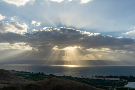 Sunlight shinning on the sea through the rain clouds. Sea of Galilee, Israel