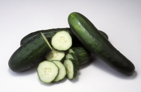 Cucumbers whole and sliced showing crossections.の写真素材