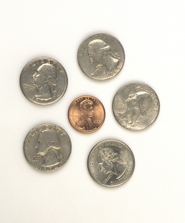 The five quarters and one penny are an example of pictures used to teach children the concepts of size and alike and different の写真素材