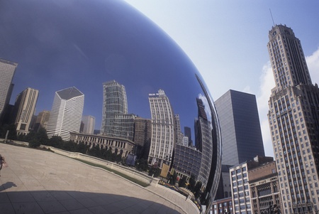 Chicago buildings reflected in the Cloud Gate sculpture in Grant Park, USA.のeditorial素材