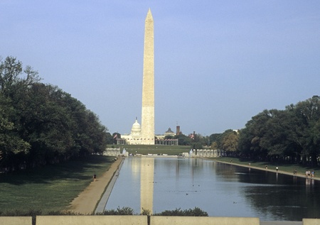 The Washington Monument is reflected in the Capitol Reflecting Pool on the National Mall, Washington DC.の写真素材