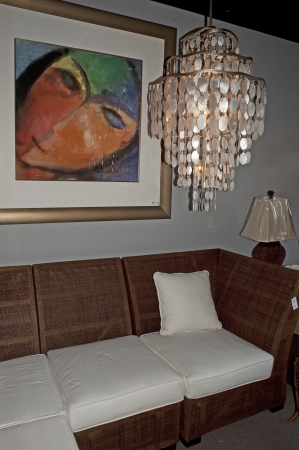 Sarasota, Florida, Beautiful chandelier hangs while large modern painting hangs on wall in expensive lighting store.のeditorial素材